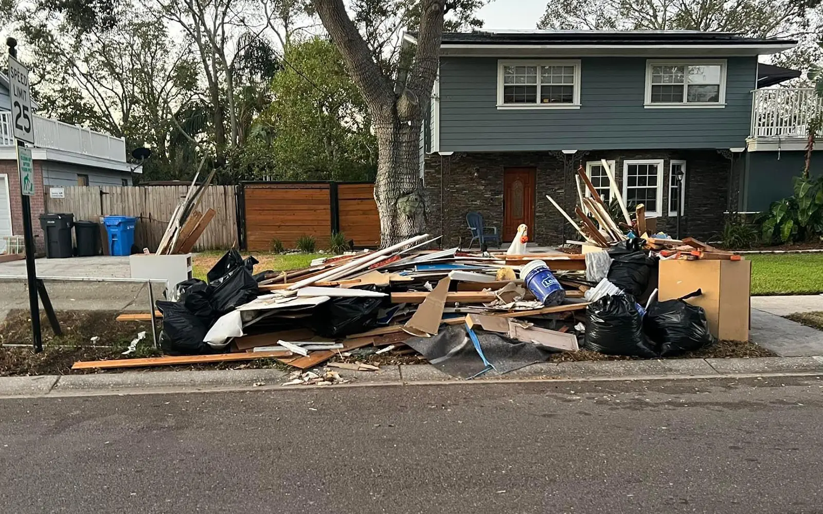 Outdoor debris loaded for removal from a residential property