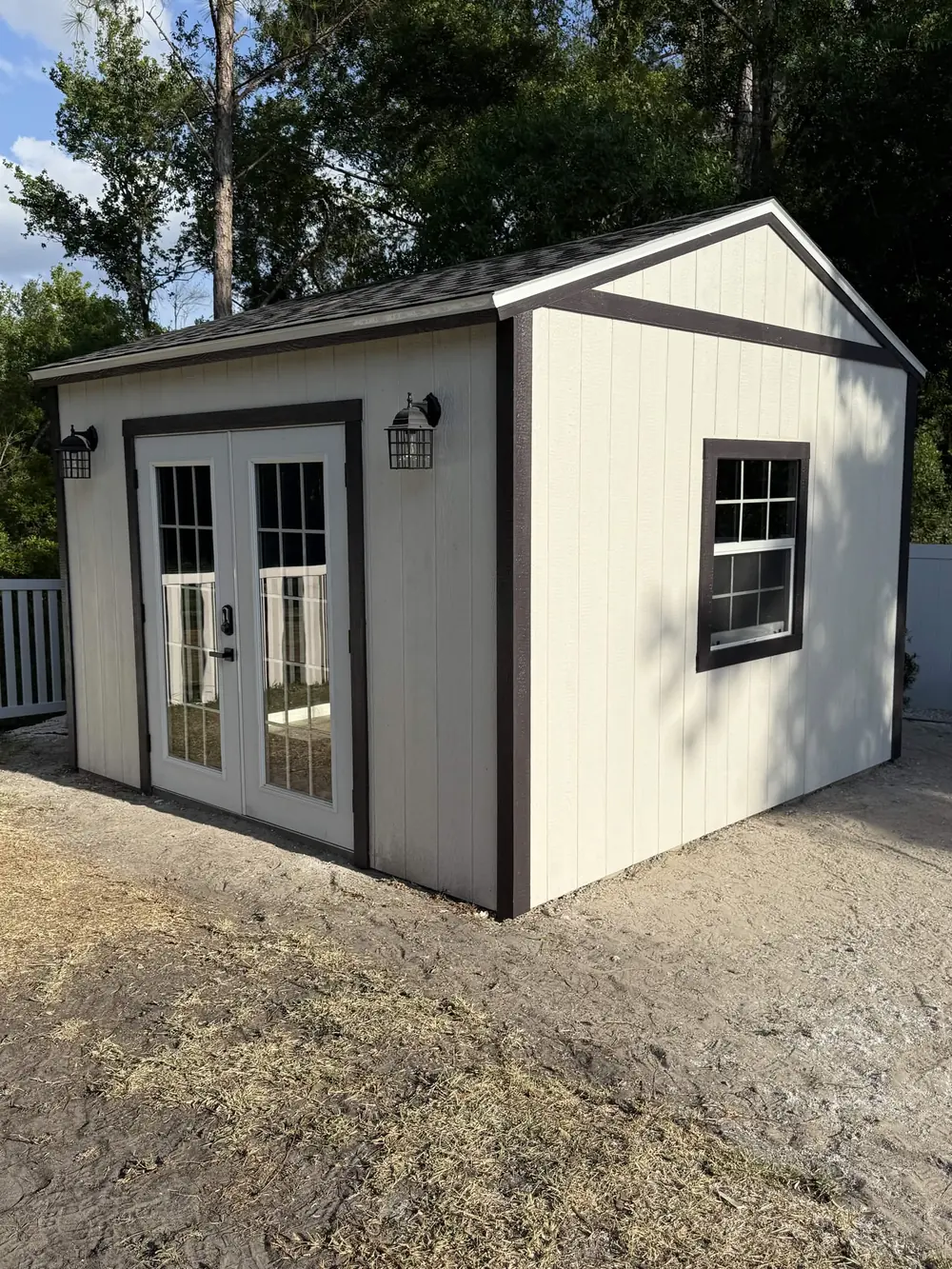 Side view of a modern white custom shed built on-site